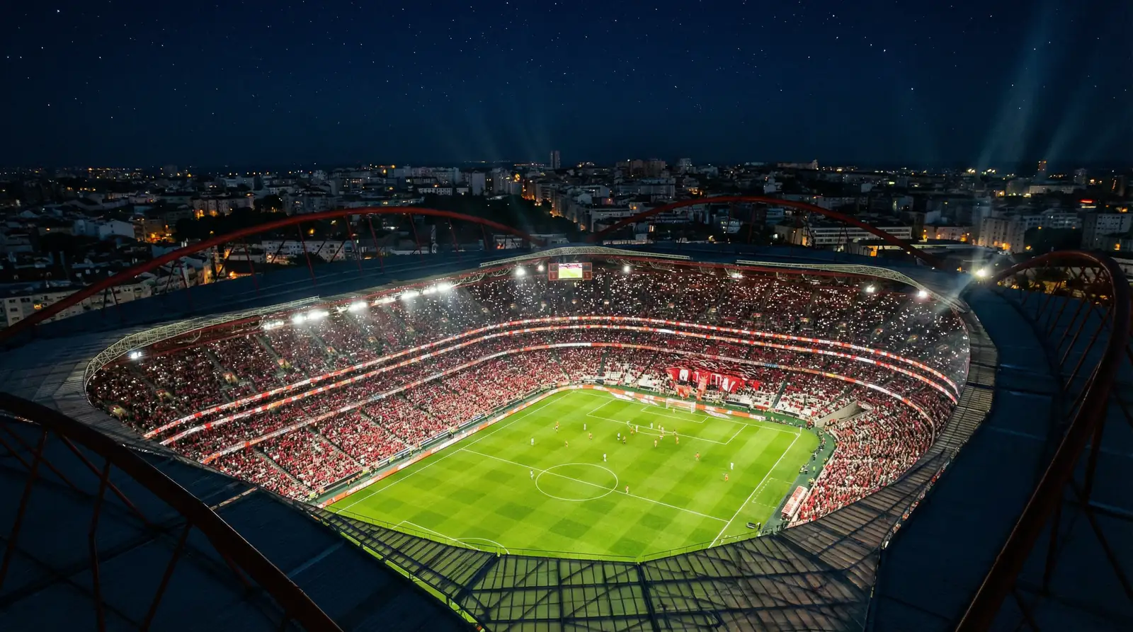 Estadio de futbol portugues iluminado durante partido nocturno de la Liga Portugal